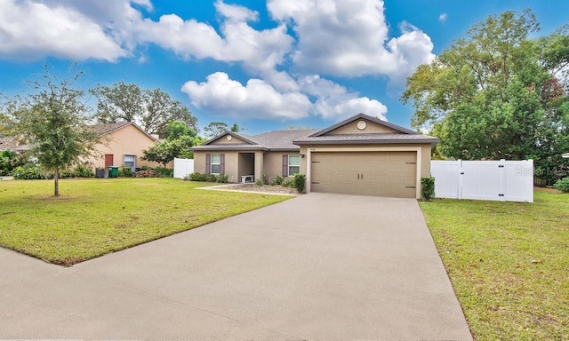 view of front of property featuring a garage and a front lawn