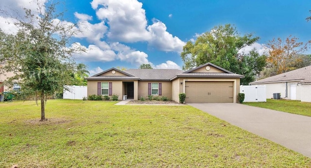 single story home with central AC, a front yard, and a garage