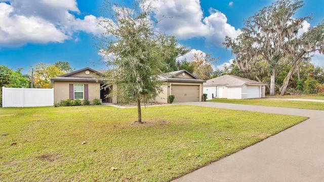 ranch-style home featuring a garage and a front yard