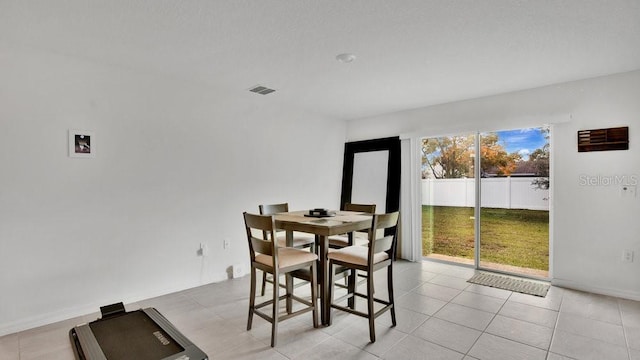 dining area with light tile patterned flooring