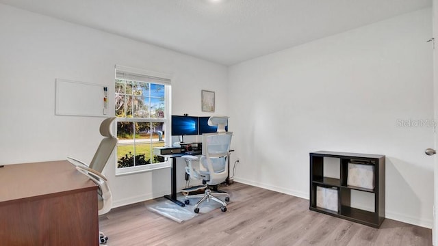 office area with light wood-type flooring