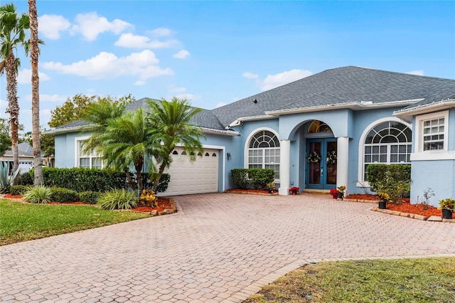 view of front of property featuring french doors and a garage