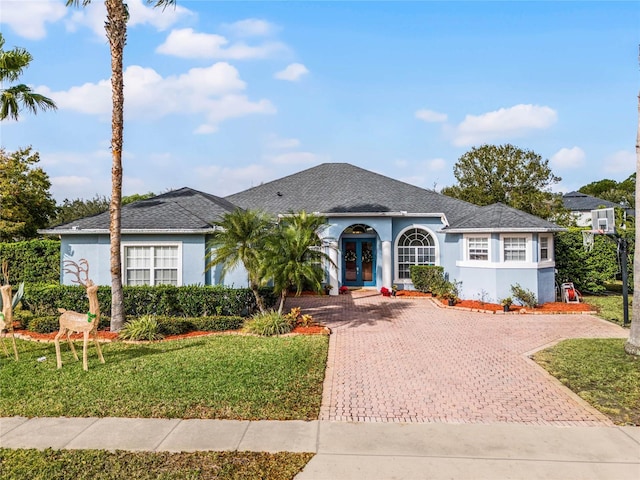 ranch-style home with a front yard