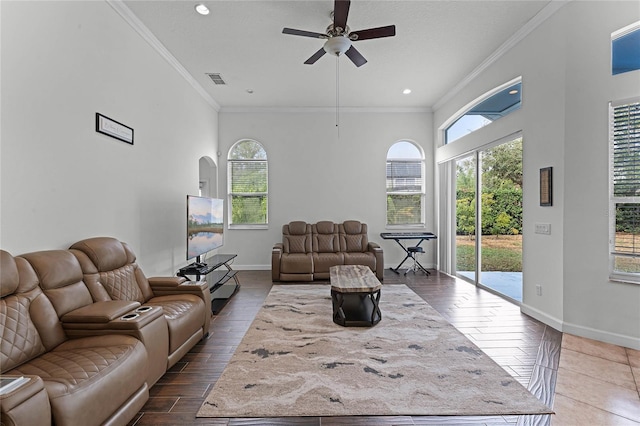 living room with ceiling fan and ornamental molding