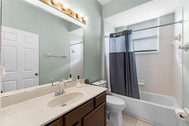 full bathroom featuring tile patterned flooring, vanity, toilet, and shower / bath combo with shower curtain