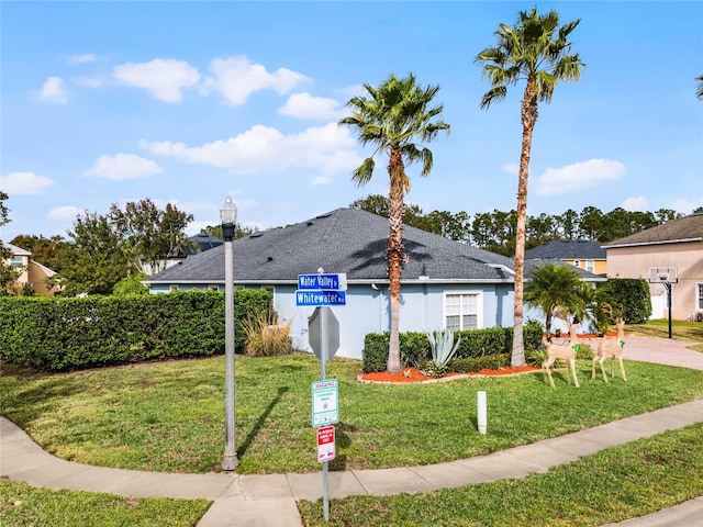 view of home's community featuring a yard