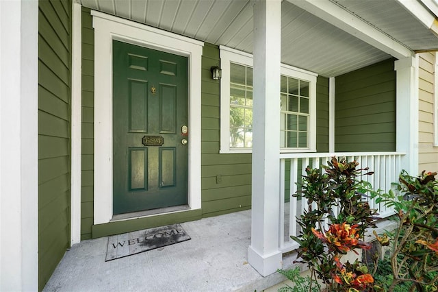 property entrance with covered porch