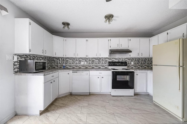 kitchen with backsplash, a textured ceiling, white appliances, sink, and white cabinets