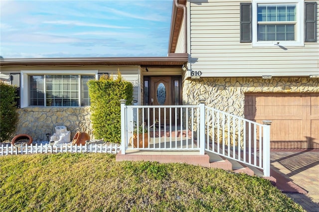 doorway to property featuring a garage