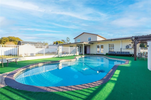 view of pool with french doors