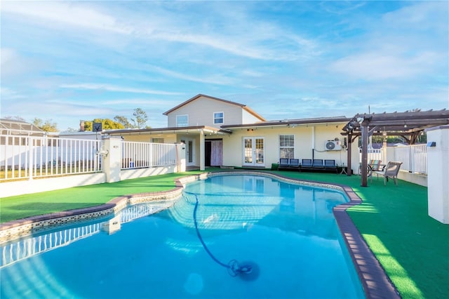 view of swimming pool featuring french doors and a pergola