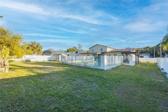 view of yard with a gazebo and a fenced in pool