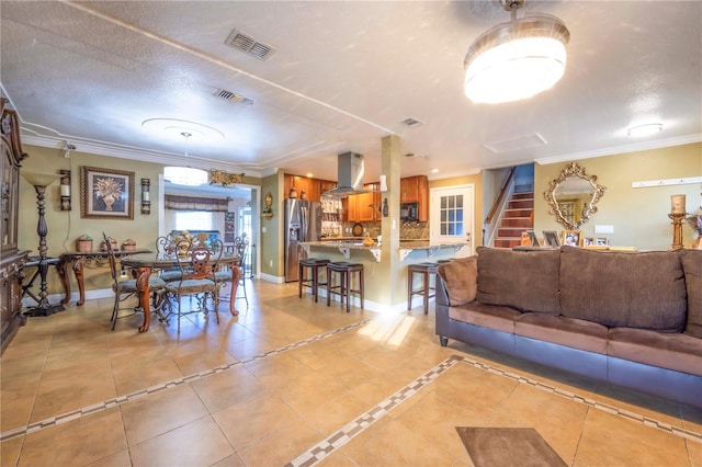 tiled dining area with crown molding