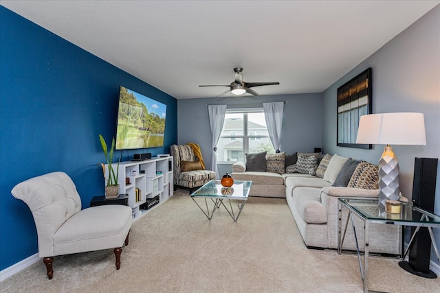 carpeted living room with ceiling fan