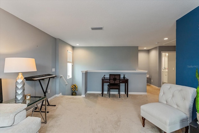 sitting room with light carpet