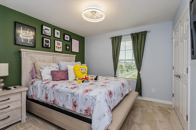 carpeted bedroom with a textured ceiling