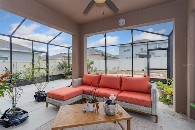 sunroom featuring ceiling fan