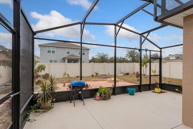 view of patio / terrace featuring area for grilling and a lanai