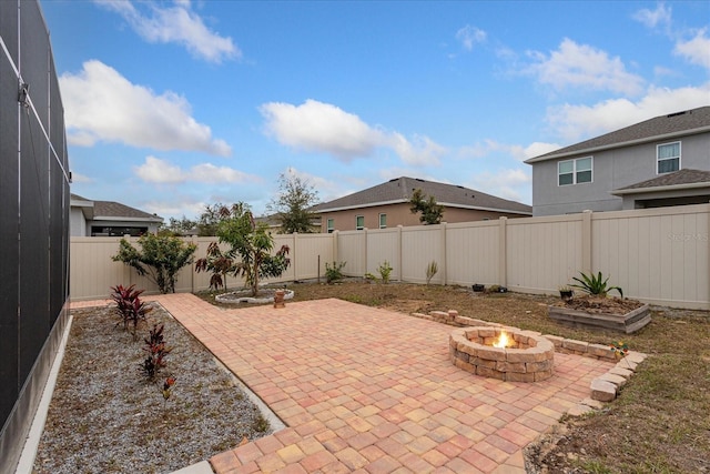 view of patio / terrace with an outdoor fire pit