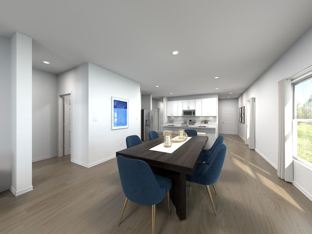 dining space featuring light wood-type flooring