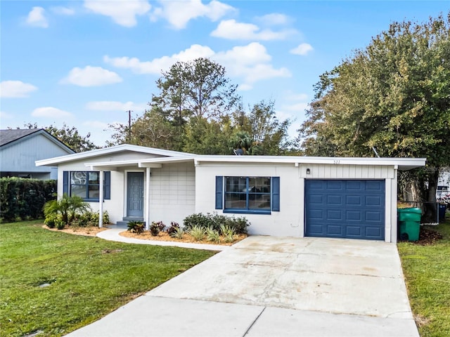 ranch-style house with a garage and a front yard