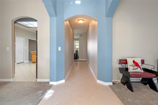 hallway featuring light tile patterned floors