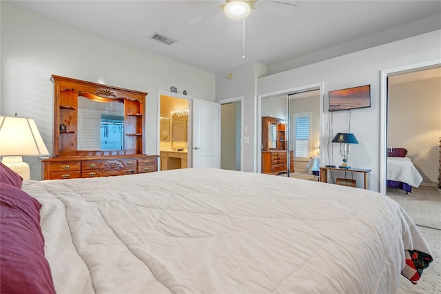 bedroom featuring ensuite bath, ceiling fan, a closet, and carpet floors