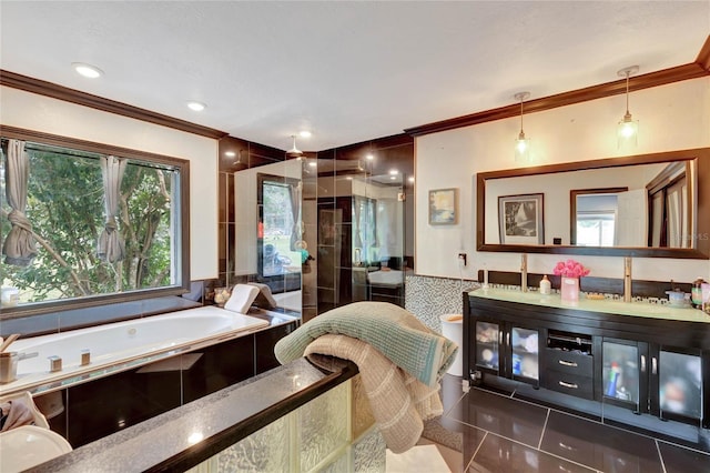 bathroom featuring tile patterned flooring, vanity, crown molding, and plus walk in shower