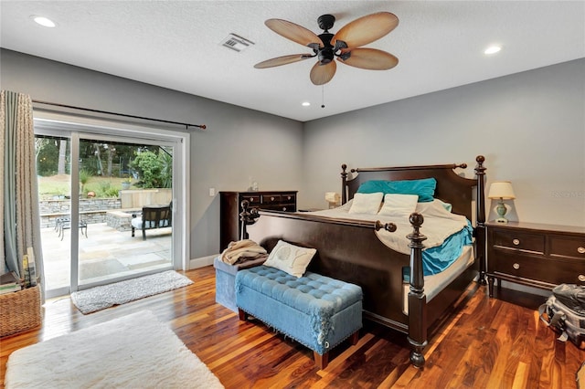 bedroom featuring access to exterior, a textured ceiling, ceiling fan, and dark wood-type flooring