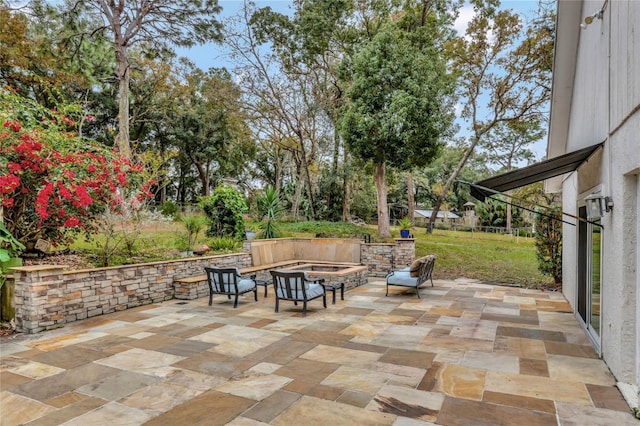 view of patio / terrace featuring a fire pit