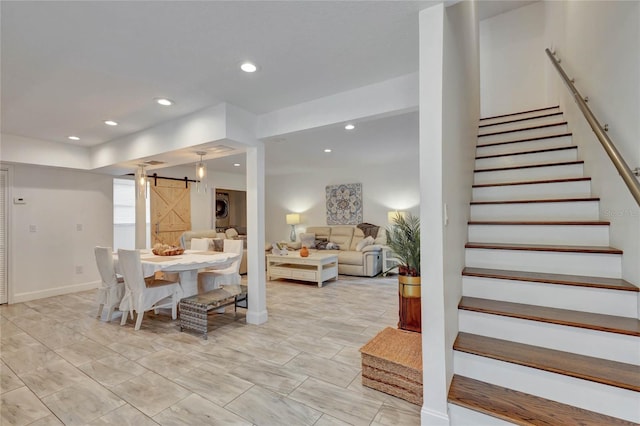 dining room featuring a barn door