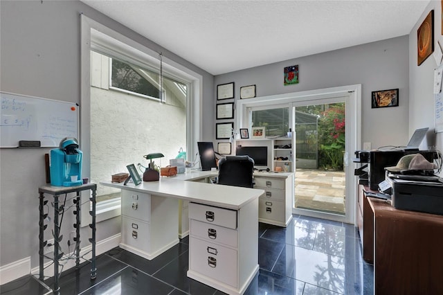 home office featuring a textured ceiling