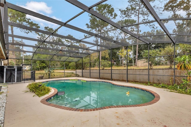 view of pool with a lanai and a patio area