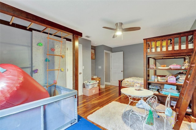 bedroom with hardwood / wood-style flooring and ceiling fan