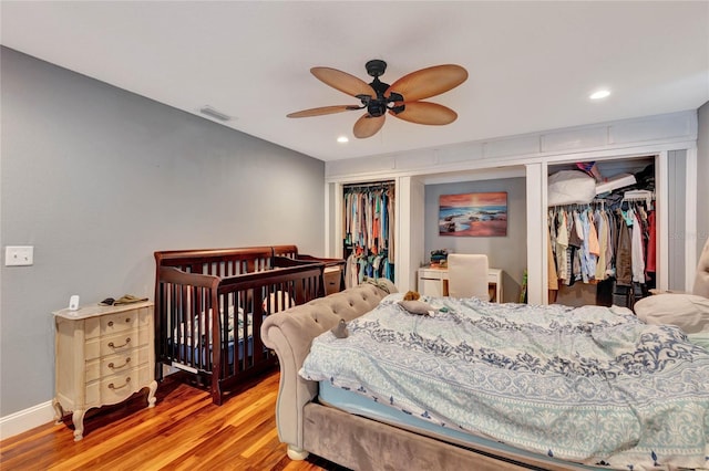 bedroom featuring light hardwood / wood-style floors, a closet, and ceiling fan