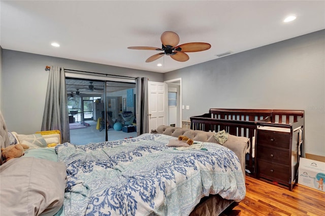 bedroom with ceiling fan, light hardwood / wood-style floors, and access to exterior