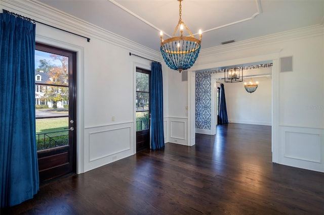 unfurnished dining area with dark hardwood / wood-style flooring, plenty of natural light, and a chandelier