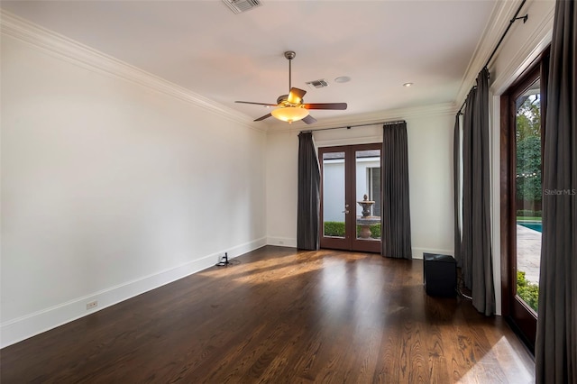 spare room with crown molding, a healthy amount of sunlight, and french doors