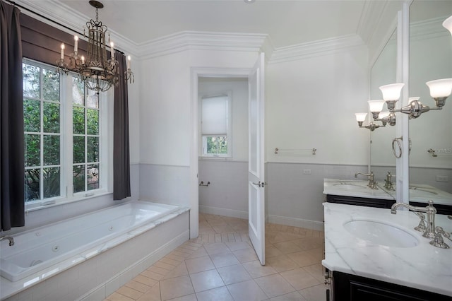 bathroom with a bathtub, tile patterned flooring, vanity, ornamental molding, and an inviting chandelier