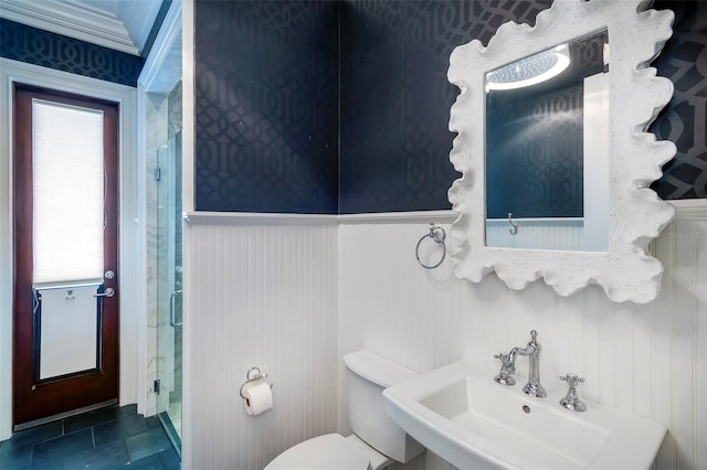 bathroom with tile patterned flooring, plenty of natural light, sink, and toilet