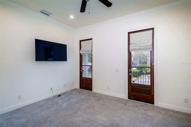 interior space with light carpet, plenty of natural light, and ornamental molding