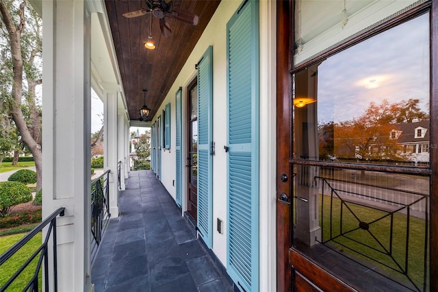 balcony at dusk with ceiling fan