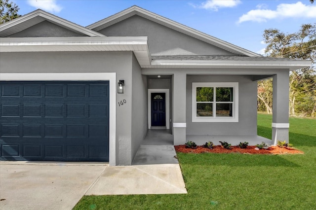 view of front of house with a front lawn and a garage