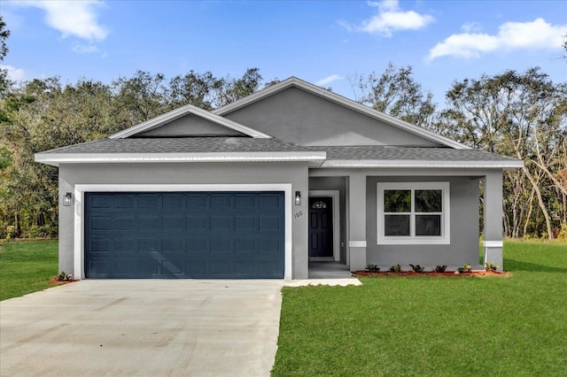 view of front facade featuring a front lawn and a garage