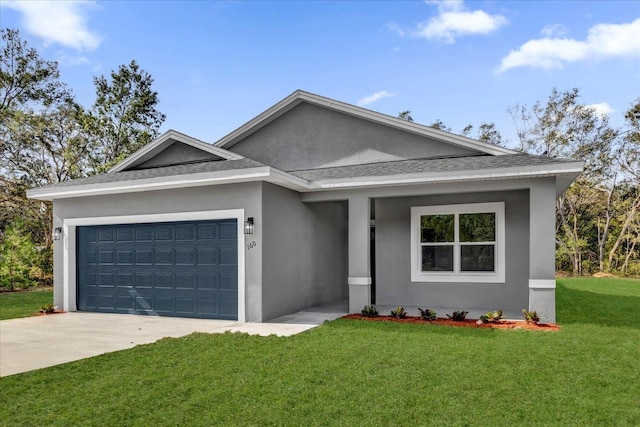 view of front of property with a front yard and a garage