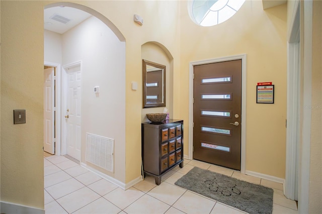 entryway featuring light tile patterned floors