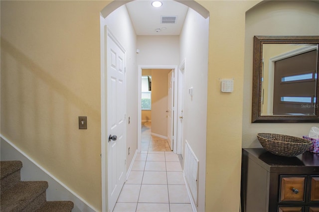 corridor with light tile patterned flooring