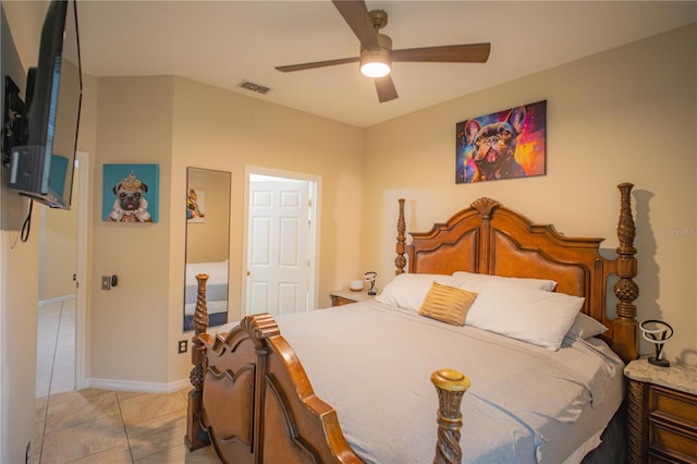 tiled bedroom with ceiling fan