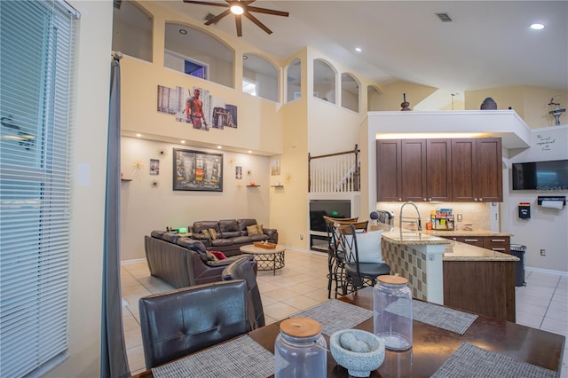 interior space featuring ceiling fan, lofted ceiling, and sink