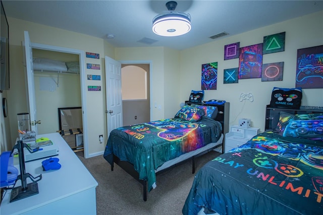 bedroom featuring carpet flooring and a closet